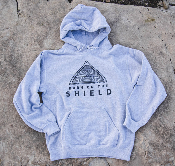 BORN ON THE SHIELD - UNISEX HOODIE - CANOE LOGO, BLACK PRINT (multiple colours)